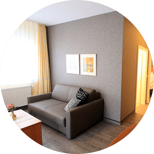 Sofa in the modernized Otto Suite in the Hotel Alexa Bad Mergentheim